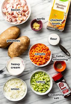 the ingredients needed to make chicken broth laid out on a marble counter top, including potatoes, carrots, celery, onions and seasoning