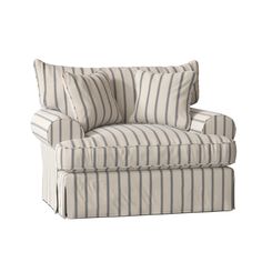 a striped chair with two pillows on it