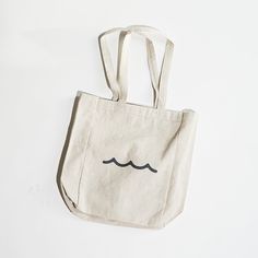 Carry your love for the shore wherever you go.This sturdy, gusseted tote is perfect for any errand or adventure — just the right size for your essentials without being too bulky.Details• 14"H x 10.5"W x 5"D• 12 oz cotton canvas• Side gussets• 23-inch handlesScreen printed in Rhode Island. Soap Company, Rhode Island, The United States, Cotton Canvas, Screen Printing, Reusable Tote Bags, Product Launch, United States, Tote Bag