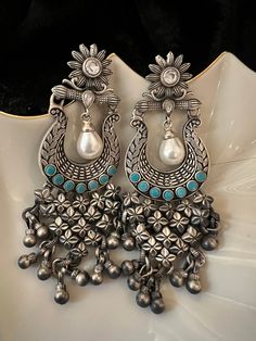 One-of-a-kind designer piece handcrafted by our skilled Indian craftsmen from Jaipur in real silver and turquoise stones and fresh water pearls This piece is a perfect example of art meets fashion.  Metal purity: 92.5 pure silver  Hallmarked The length of the earrings is 9.5 cm The width of the earrings is 3.5 cm The weight of the earrings is 53 grams per pair. Traditional Turquoise Danglers For Gift, Festive Round Turquoise Earrings, Festive Turquoise Round Earrings, Traditional Turquoise Earrings With Latkans, Handmade Turquoise Earrings For Festive Occasions, Traditional Turquoise Earrings As A Gift, Bohemian Turquoise Chandbali Jewelry, Handmade Festive Turquoise Earrings, Festive Handmade Turquoise Earrings