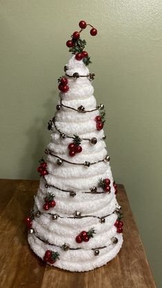 a white christmas tree made out of toilet rolls