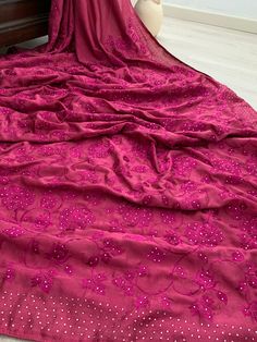 This Beautiful Magenta Crepe Georgette  Silk Saree is with beautiful embroidered  Border And Pallu !!  Light weight, Easy to Drape and Fall Well!! Comes with an unstitched matching blouse piece. Material: Semi Crepe Georgette  Silk (Very Good Quality, Feels like Pure) Fall & Pico ✅  ** Jewellery is not included! Disclaimer: slightly color variations may be possible due to light effects! Floor-length Blouse Piece With Zari Work For Celebration, Party Embroidered Dola Silk Fabric, Pink Bollywood Style Embroidered Fabric With Dabka Work, Traditional Wear With Resham Embroidery In Georgette For Celebration, Floor-length Saree With Zari Work For Celebrations, Semi-stitched Floor-length Saree For Celebration, Traditional Floor-length Saree For Celebration, Floor-length Saree For Navratri Celebration, Festival Celebration Floor-length Saree