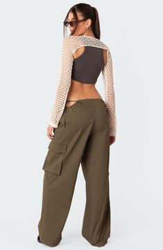 Stand out in streetwear-inspired style with these roomy cargo pants featuring flirty side cutouts, handy pockets and a low rise for a 2000s-inspired look. 100% cotton Machine wash, dry flat Imported Y2k Style Cargo Pants With Pockets For Fall, Relaxed Fit Cropped Bottoms For Streetwear, Y2k Straight Cargo Pants With Cargo Pockets, Cropped Bottoms For Fall Streetwear, Y2k Cropped Bottoms For Spring, Casual Cropped Pants For Streetwear, Spring Cropped Streetwear Bottoms, Spring Streetwear Cropped Bottoms, Y2k Style Summer Cargo Pants With Pockets