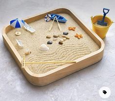 a sand tray with various items on it