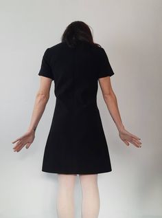 Made under request! Handmade dress in soft wool with lining 90%polyester 2%elastan 8%viscose Color: Black You can see here an example on a coat from the fabric https://www.etsy.com/listing/206734254/mod-wool-coat-60s-retro-soft-light-blue?ref=shop_home_active_1 You can choose your own measurements, length. Special request are easy, just add this listing to your cart https://www.etsy.com/listing/624364219/special-requests?ref=shop_home_active_25 If you want it on a rush you have priority shipping Modern Fitted A-line Mini Dress, Tailored Black V-neck Dress, Fitted A-line Midi Dress With French Seams, Modern Fitted A-line Midi Dress, Classic Fitted Mini Dress Lined, Fitted A-line Winter Dresses, Lined Stretch Mini Dress For Work, Stretch Lined Mini Dress For Work, Fitted Wool V-neck Dress