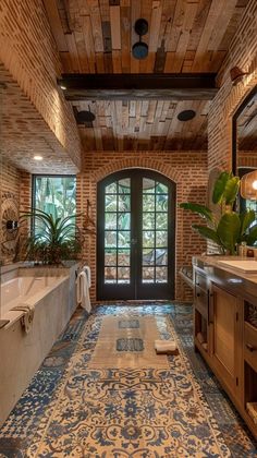 a large bathroom with an ornate tile floor