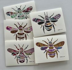 four bee cards with different designs on them