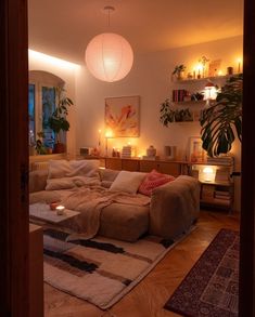 a living room filled with furniture and lights