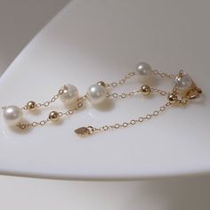 Carefully selected 6-7 Aurora freshwater pearls sparkle like light bulbs, have a classic beauty and add brilliance to the neck. Made from a 14K cast gold chain, this necklace is durable and has 14K gold certification. Simplicity and subtlety are key, no need for fancy beading or extra playfulness for a soft touch. Wear alone or layered for a trendy and versatile look Metal: 14K Gold Filled Gemstone: Freshwater Pearls Pearl Diameter: 6-7mm Length: 14-18mm Weight: 1.7g Edison Pearls, Chain Bracelets, Tiger Eye Stone, Pearl Chain, Classic Beauty, Stardust, Pearl Bracelet, Light Bulbs, Chain Bracelet