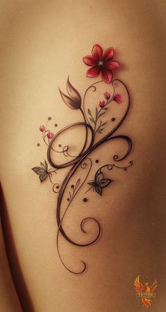 the back of a woman's stomach with flowers and swirls on her side