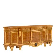 an ornately carved wooden sideboard against a white background