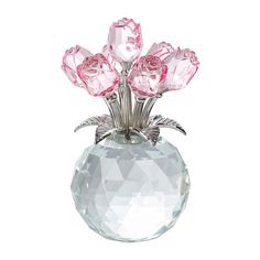 a crystal vase with pink roses in it on a white background, for decoration or as a centerpiece