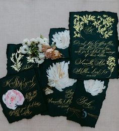 four black and gold wedding cards with flowers on them