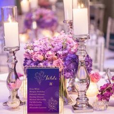 the table is set with candles and flowers