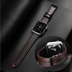 an apple watch with brown leather straps and a black case on top of a table