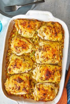 a casserole dish filled with chicken and vegetables