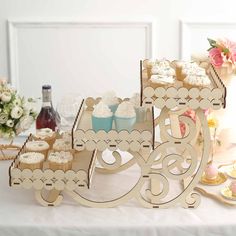 a table topped with cupcakes and cakes