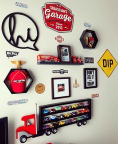 the wall is covered with various cars and magnets for children's room decor