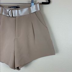 Sibel Brand, From Lo Lem Shop In Vietnam. Tan Colored Dress Shorts With A Removable Belt. Pleated Front. Zipper Fly And Button Closure. Front Pockets. Very High Quality Fabric. High Waisted. New With Tags. Sizing : Small. Waist - 12.5” Length - 12.5” Inseam - 2” Rise - 12” Hips - 20” Fitted Elegant Shorts For Day Out, High Waist Formal Shorts For Spring, Beige Fitted Shorts For Party, Formal High Waist Shorts For Spring, Belted Shorts For Night Out In Summer, Beige Belted Shorts For Spring, Belted Beige Shorts For Summer, Elegant Shorts With Belt Loops For Spring, Spring Fitted Belted Shorts