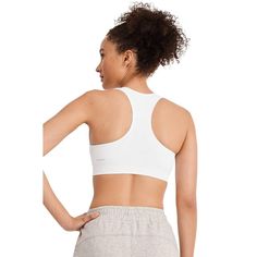 The Jockey Seamfree Mid Impact Sports Bra delivers stretchy softness for total comfort before, during and after your workout. Made with at least 62% recycled nylon in a smooth, Seamfree design, this sweat-wicking phenom features a ribbed underbust band for comfortable support during medium-impact activities. Finished with removable cups for customizable shaping and coverage, and a racerback design for superb range of motion, this Jockey sports bra is your go-to favorite for the gym and beyond. White Supportive Activewear For Light Sports, Supportive White Go-dry Activewear, Sporty Supportive White Activewear, Supportive White Sweat Resistant Activewear, Supportive White Sweat-resistant Activewear, Supportive Sweat-resistant White Activewear, Supportive White Activewear For Light Sports, Supportive White Activewear For Yoga, Supportive White Activewear For Sports