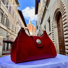 This bag has been made of the best genuine leather by local master crafters of Florence in Italy, designed for women who only accept premium Italian quality and luxury leather bags and modern Italian fashion. . . Sizes: Width: 32cm/ 12.6 inches Height: 20cm/ 8 inches Depth: 12cm/ 4.7 inches . . The story of this bag :  Introducing our exquisite Florence Leather Bag, a true embodiment of Italian craftsmanship and timeless elegance. Handcrafted with utmost care in the heart of Florence, Italy, this bag is a masterpiece that seamlessly combines style, functionality, and luxury. Imagine strolling through the charming streets of Florence, feeling the warm Mediterranean breeze against your skin. As you delve deeper into the city's rich history and artistic heritage, you can't help but notice the Elegant Satchel With Leather Lining As Gift, Elegant Satchel With Leather Lining For Gift, Elegant Leather-lined Satchel For Gift, Elegant Leather Satchel Gift, Elegant Leather Satchel As Gift, Elegant Leather Satchel For Gift, Leather Clutch With Smooth Grain, Italian Leather Bag As Gift, Italian Leather Bag As A Gift