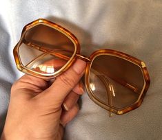 "Hello and Welcome to LiamBySevanna! Prior-purchasing any listing from this shop, please Ask question/s, Request additional photos, to make sure the listed item, is the right choice for you! Per our store policy we don't accept returns Listing is for: Vintage 1970 Brigitte Bardot style Tortoiseshell Ted Lapidus Sunglasses Oversized Original Frame Paris. Have normal sign of wear/used.  Reminder: You can \"always\" prevent any wrong purchase/s by Communicating, Inquiring and Questioning Prior making any Purchase! We provide pictures and share any info known about the listing accordingly. Don't assume, please ask. Thank you Kindly." 70s Sunnies, Big 70s Glasses, 60s Sunglasses Vintage, 1970 Sunglasses, 70s Glasses, Ted Lapidus, Vintage Tortoiseshell Sunglasses, Bardot Style, Oversized Sunglasses