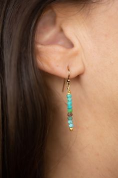 Add a touch of elegance to any outfit with the Root Turquoise Gold Earrings. These dainty earrings feature solid natural stones with bright gold accents for a chic and refined look. Whether it's a casual day out or a special occasion, these earrings are the perfect accessory. Dainty Turquoise Earrings For Everyday, Everyday Turquoise Gemstone Earrings, Elegant Everyday Turquoise Earrings, Bright Gold, Dainty Earrings, Gold Accents, Blue Hues, Green And Gold, Natural Stones