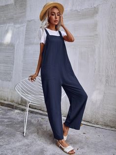 This Dual Pocket Sleeveless Jumpsuit is the perfect combination of comfort and style. Crafted from a lightweight fabric blend with a slight stretch, this jumpsuit offers you optimal breathability and flexibility. The stylish letter pattern gives it an edgy look, while the dual pocket design adds practicality to your everyday outfit. It also features a collared neckline, short sleeves, and a short length that provides coverage without sacrificing fashion. This jumpsuit is sure to keep you comfortable all day long in any season! Features: Color: Navy Blue Style: Casual Pattern Type: Plain Type: Overall Details: Button, Pocket Length: Long Fit Type: Regular Fit Neckline: Straps Sleeve Length: Sleeveless Waist Line: Natural Fabric: Non-Stretch Material: Fabric Body: Unlined Sheer: No Size Char Comfy Jumpsuits, Stylish Letters, Fitted Jumpsuit, Green Jumpsuit, Edgy Look, Sleeveless Jumpsuits, Natural Fabrics, Blue Fashion, Everyday Outfits