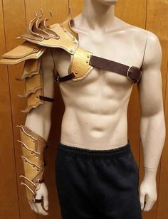 a male mannequin with leather armor on it's chest