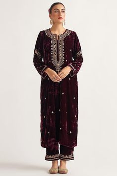 Featuring a wine kurta in velvet base with hand embroidery. It is paired with matching palazzo pants. This product will be shipped to you after 1-2 weeks from the date of order placed. All custom made orders are not returnable. Pls contact for Size chart and for other more colors Request You :To provide contact details for courier services. {VARIATION MAY COME DEPENDING UPON AVALIBILITY OF LACES OR GOTTA PATI or TUSSELS} NOTE:  1) Visual Samples on website may differ slightly from actual product due to light & effects during photography (Length & Breadth have 1 n 1.5 inches +/-). 2) Before placing order ,pls confirm product n color availability and  For Wholesale Order MOQ is 5 Pieces of any color/Pattern on +91 7903893945 & +91 8447750028(WhatsApp) Bridal lehanga ,indian wedding,Canada we Velvet Suit Design, Velvet Outfit, Velvet Kurta, Velvet Embroidery, Independance Day, Velvet Dress Designs, Pant For Women, Velvet Suit, Embroidered Pants