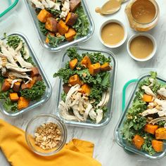 four plastic containers filled with food on top of a table