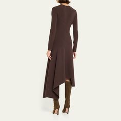 Michael Kors Collection handkerchief dress  Crew neckline Long sleeves Zip closure at back Asymmetrical hem  Hem falls below the knee Virgin wool/elastane Made in Italy Handkerchief Dress, Michael Kors Collection, Asymmetrical Hem, Asymmetric Hem, Crew Neckline, The Knee, Tops Designs, In Italy, Michael Kors