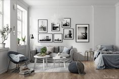 a living room filled with furniture and pictures on the wall