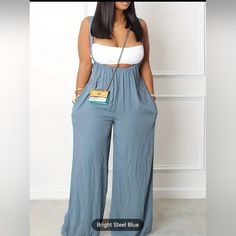 Women’s Casual Boho Wide Leg Solid Textured Suspender Loose Jumpsuit High Rise Design, Fixed Suspenders, Wide Legs, Side Pockets Material Fabric Is 65% Polyester, 35%Cotton Colors Available: Rose Pink/Steel Blue/Black Size: L(8/10) Waist Size: 45.7" Hip Size:48.1" Bottom Length:41.8" Inseam:24.8" Crop Top And Purse Not Included * Please Message Me For Your Desired Color. Summer Bottoms With Adjustable Straps For Night Out, Adjustable Straps Bottoms For Night Out In Summer, Chic Summer Jumpsuits And Rompers With Suspenders, Chic High Waist Bottoms With Suspenders, Chic Overalls With Suspenders For Spring, Chic Spring Bottoms With Suspenders, Chic Jumpsuits And Rompers With Spaghetti Straps And Pockets, Summer Party Bottoms With Adjustable Straps, Trendy High-waist Jumpsuits And Rompers With Suspenders