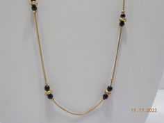 "Vintage 29\" gold tone necklace adorned with black beads & gold tone spacers. Spring ring fastener. Excellent condition." Black Jewelry With Gold Beads For Formal Occasions, Formal Black Jewelry With Gold Beads, Black Beads Chains, Black Beaded Necklace, Black Beads Mangalsutra Design, Mangalsutra Design, Black Beads Mangalsutra, Diamond Bangles, Gold Mangalsutra Designs