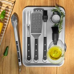 an assortment of kitchen utensils on a tray