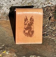 "This listing is for a beautiful handcrafted all leather money clip wallet. It features a top grain leather outer that has been laser engraved with a detailed German Shepherd design. The inside pockets and liner are made from a unique tan leather. It has a card pocket on each end and money clip for cash in the center. It measures approximately 4\" x 2 7/8. These money clip wallets make great gifts and will last for years. Please feel free to message me about custom engraving designs on these." Leather Card Holder With Engraved Logo, Everyday Rectangular Card Holder With Engraved Logo, Leather Trifold Wallet With Engraved Logo, Leather Trifold Wallet With Engraved Logo For Everyday Use, Custom Hand-tooled Trifold Wallet, Custom Hand-tooled Rectangular Trifold Wallet, Hand Tooled Leather Trifold Wallet As Gift, Engraving Designs, Leather Money Clip