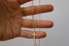 This simple cross necklace is perfect for the minimalist. D E T A I L S *It features a small gold filled cross measuring 15mm and with a thickness of 0.45mm (25gauge). *It is suspended from a dainty 18k gold filled box chain. *Gold fill is an actual layer of pure gold that is pressure bonded to a base metal and unlike gold plated items does not tarnish or rub off. *It closes with a  gold filled hallmarked spring ring clasp. C A R E * T I P To keep your necklace in good condition please avoid con Everyday Minimalist Cross Pendant Necklace, Minimalist Daily Wear Cross Pendant Necklace, Minimalist Everyday Cross Necklace, Simple Yellow Gold Cross Necklace, Simple Everyday Cross Pendant Necklace, Simple Everyday Cross Necklace, Simple Gold Cross Pendant Necklace, Minimalist Yellow Gold Cross Necklace Gift, Minimalist Yellow Gold Cross Necklace