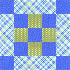 a blue and green patchwork quilt