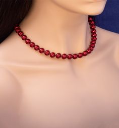 Dazzle in uniqueness with our Bordeaux pearls—deep wine hue, unparalleled brightness, and reflectivity. This red pearl statement necklace is a radiant standout piece! Round shape 10 mm superior glazed pearls are individually hand-knotted for lasting luster and beauty. White gold plated spring ring clasp is easy to secure on neck and it is durable. Length: 18 inches long Necklace weight: 54 g 18k white gold spring ring clasp closure. Package contents: a necklace and a jewelry box Warranty: one ye Elegant Red Pearl Necklace Gift, Elegant Red Round Pearl Necklace, Elegant Red Pearl Necklace For Formal Occasions, Elegant Single Strand Red Pearl Necklace, Elegant Red Single Strand Pearl Necklace, Pearl Statement Necklace, Red Pearl, Spring Rings, Long Necklace