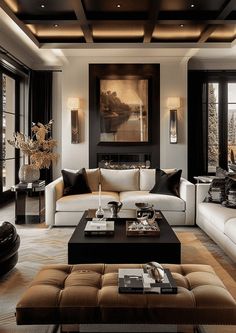 a living room filled with lots of furniture and large windows in the wall behind it