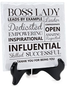 a black and white sign that says boss lady with words on the front of it