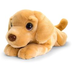 a stuffed dog is laying down on the floor with its eyes wide open and it's head tilted to the side