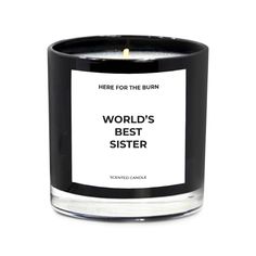 a black candle with a white label that says wake me up when this is over