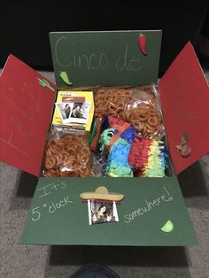 a box filled with lots of different types of food in it's packaging and labeled cinco de mayo