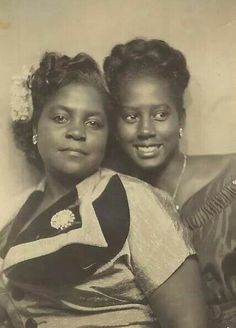 an old black and white photo of two women