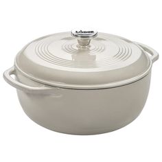 a white casserole dish with a lid and handles on the bottom, sitting in front of a white background