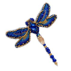 a beaded dragon brooch with blue beads and gold accents on it's wings