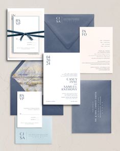 an assortment of wedding stationery and envelopes