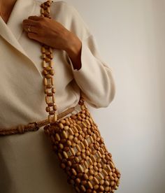 Wooden Beaded Bucket Bag, Beige Bamboo Handmade Shoulder Bag, Natural Wood Summer Bag With Linen Pouch Attention! Measurements in photos are in centimeters. In this shop, I produce stylish and timeless bags with my imagination. My bags are the combination of natural materials and handcraft. I design useful and different models with love. I can improve myself with your ideas and suggestions and produce bags according to your wishes. Let's design together! * Details Handmade item Proper for casual Natural Beaded Bag As Gift, Natural Beaded Bag Perfect For Gifts, Natural Beaded Bags Perfect For Gifts, Natural Rectangular Bag With Wooden Beads, Rectangular Natural Bag With Wooden Beads, Brown Bag With Wooden Beads For Everyday Use, Beaded Rectangular Shoulder Bag In Natural Color, Rectangular Beaded Shoulder Bag In Natural Color, Beaded Natural Rectangular Shoulder Bag